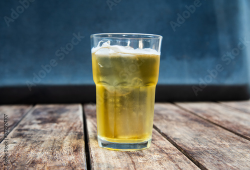 Beer in glass on wooden table drinking concept.