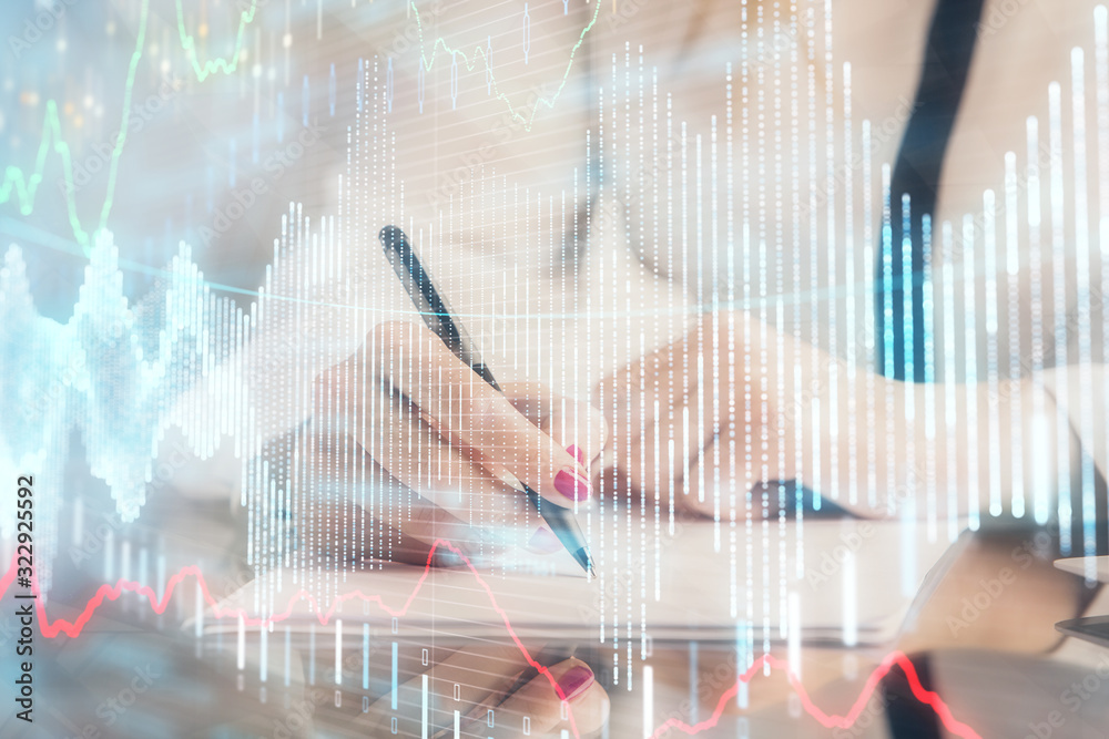 Double exposure of hands making notes with forex chart huds. Stock market concept. Double exposure of hands making notes with forex chart huds. Stock market concept.