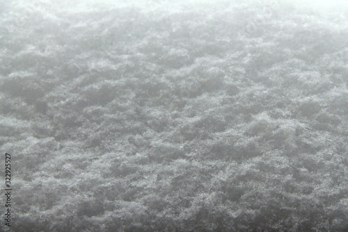 White fluffy snow texture with a gradient from light to dark