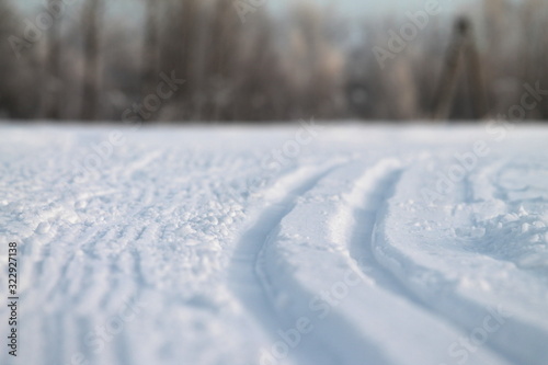Ski track in snow , active winter holiday concept.