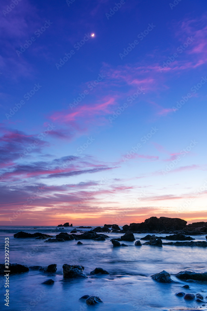 A Sunset Over The California Coastline With The Moon. High Quality Photo