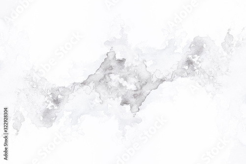 abstract black splashes on white watercolor paper. monochrome image.