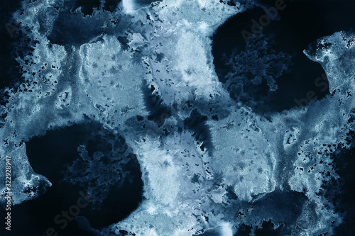 abstract splashes on black background. monochrome image.