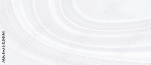 White gray satin texture that is white silver fabric silk background with beautiful soft blur pattern natural.