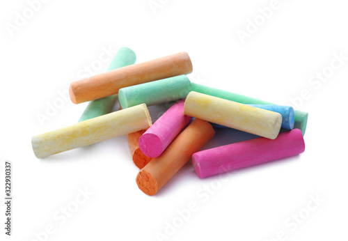Color pieces of chalk on white background photo