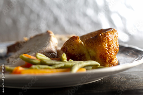 Schilderij op canvas Yorkshire pudding on a plate with meat and vegetables