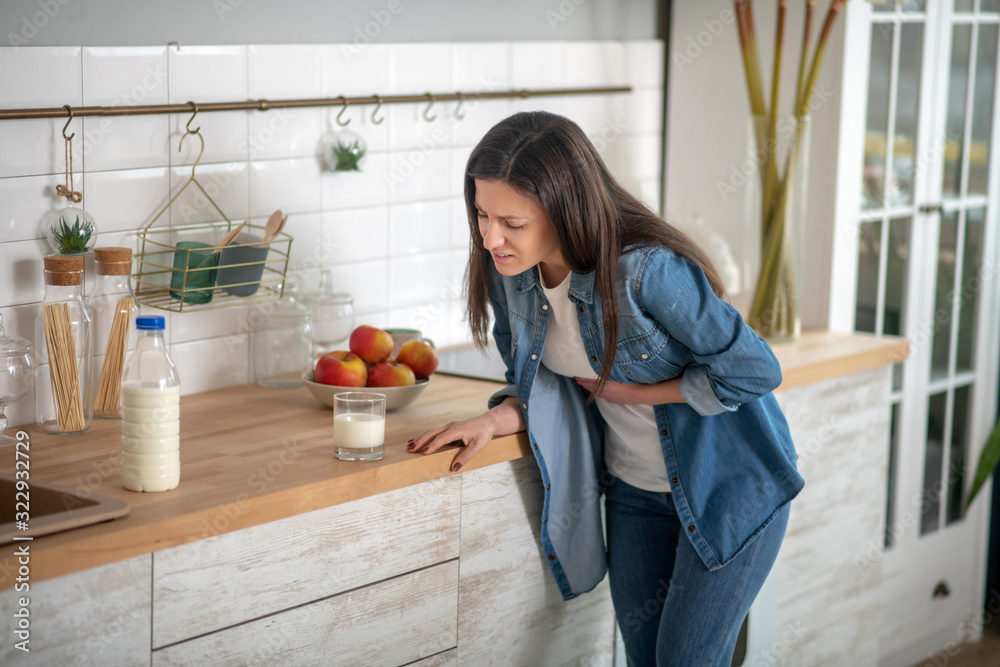 © zinkevych - Lactose intolerant woman unable to drink milk © zinkevych - Lactose intolerant woman unable to drink milk
