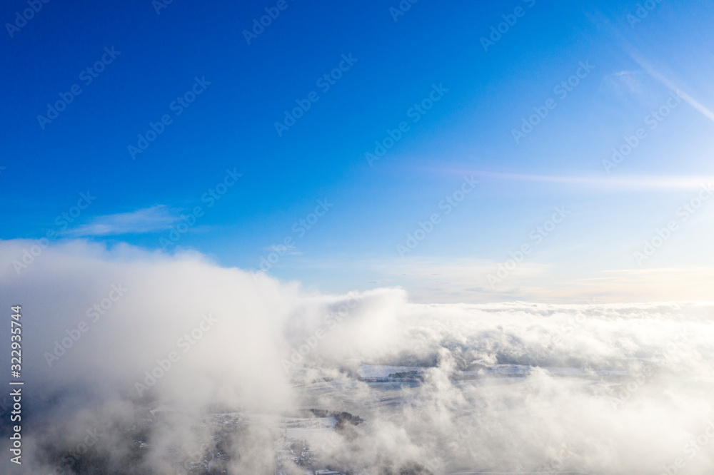 Aerial view clouds over forest. Aerial view of forest and clouds. Aerial drone view flying over the forest. Aerial top view cloudscape. Texture of clouds