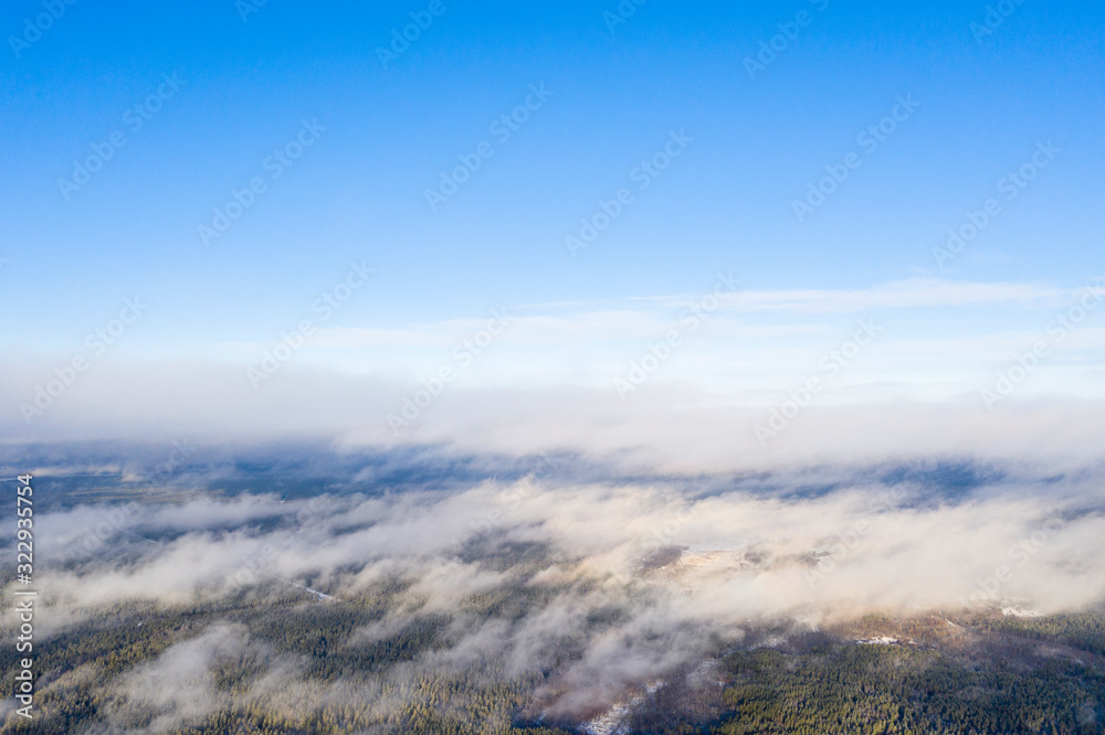 Aerial view clouds over forest. Aerial view of forest and clouds. Aerial drone view flying over the forest. Aerial top view cloudscape. Texture of clouds Aerial view clouds over forest. Aerial view of forest and clouds. Aerial drone view flying over the forest. Aerial top view cloudscape. Texture of clouds