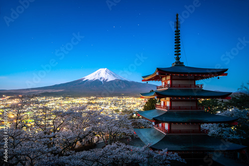 Fujiyoshida  Japan at Chureito Pagoda and Mt. Fuji in the spring with cherry blossoms full bloom during twilight. Japan Landscape and nature travel  or historical building and sightseeing concept.