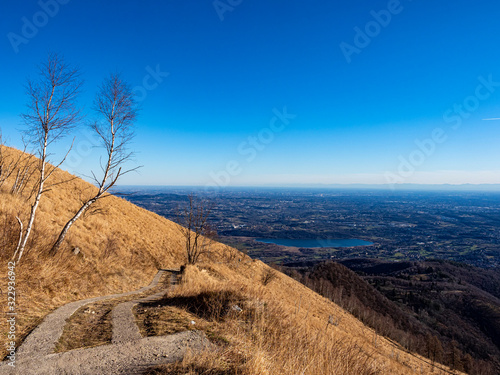 Alpine trail on mount Bolettone in the italian alps photo