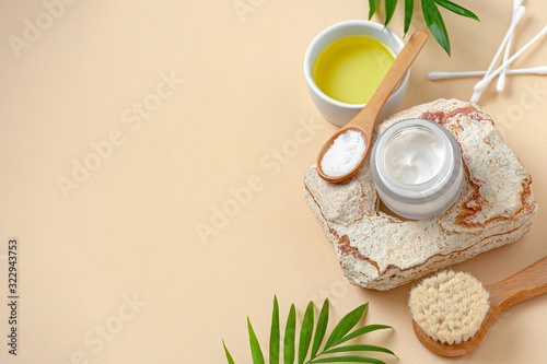 Cream and olive oil for body care. Background image with free space for text.