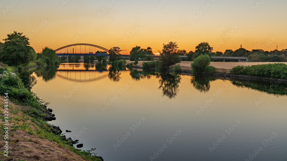 A Bridge over the River Ruhr in the evening light, seen in Duisburg, North Rhine-Westfalia, Germany