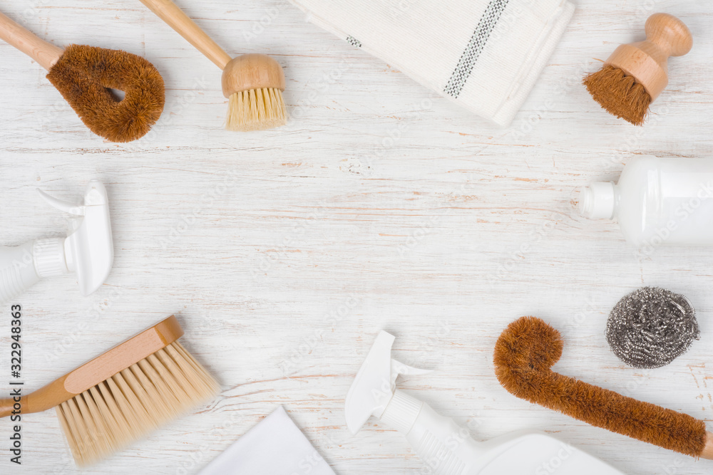 Eco natural cleaning brushes, cloth and detergent on wooden background Eco natural cleaning brushes, cloth and detergent on wooden background