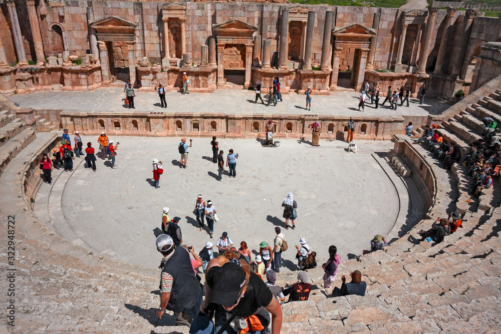 Some tourists visit the archaeological ruins of the Roman city of Jerash, in Jordan.