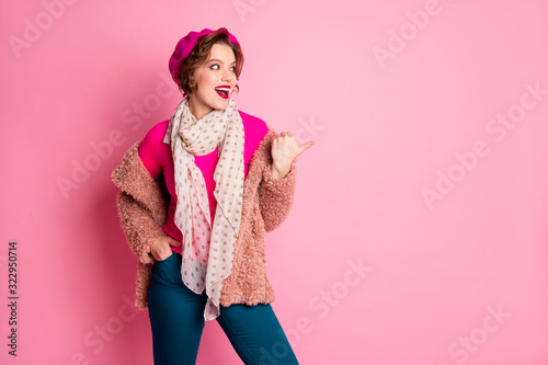 Portrait of funky french girl point forefinger copy space direct sales discount promo ads choose decide option wear outerwear blue pants trousers jumper cap shawl isolated pink color background