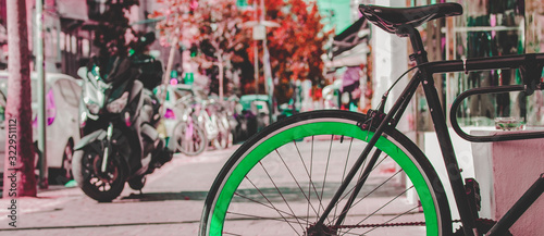 color inversion artistic concept picture of vintage cycle vehicle object outside on street in sunny day tine toning in saturated pink color © Артём Князь