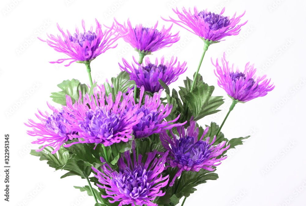 Decorative artificial purple flower on white background. Decorative artificial purple flower on white background.