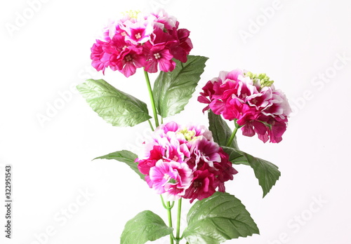Decoration artificial pink flower on white background.