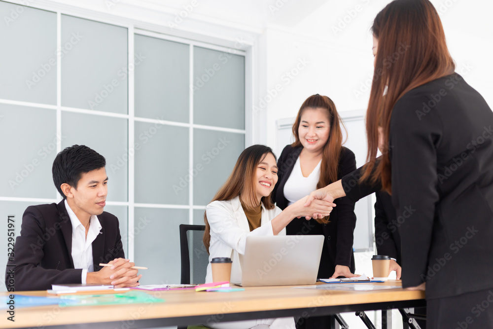 asian officer group meeting and discussion in office, they shaking hand and talking about business strategy, unity and teamwork, they feeling happy and smile asian officer group meeting and discussion in office, they shaking hand and talking about business strategy, unity and teamwork, they feeling happy and smile