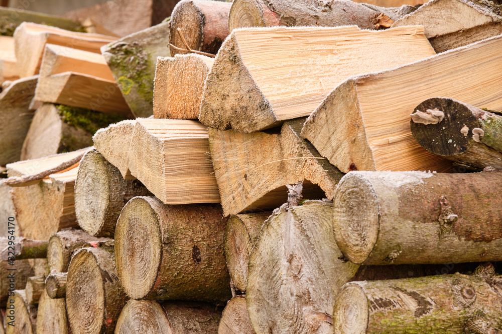 Close-up of a heap of firewood outdoors on a frosty winter day. Seen in Bavaria, Germany, in January Close-up of a heap of firewood outdoors on a frosty winter day. Seen in Bavaria, Germany, in January