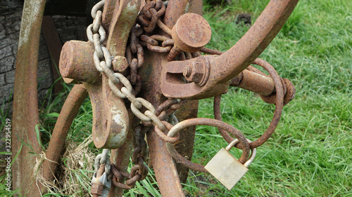 old padlock on farming equipment