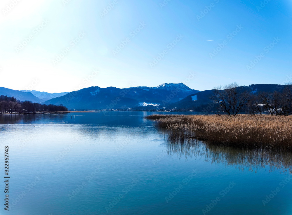 Naklejka premium Gmund am Tegernsee in Upper Bavaria (Oberbayern) and view to magical waters of the lake and mountains lanscapes from the north shore of the Tegernsee lake in winter