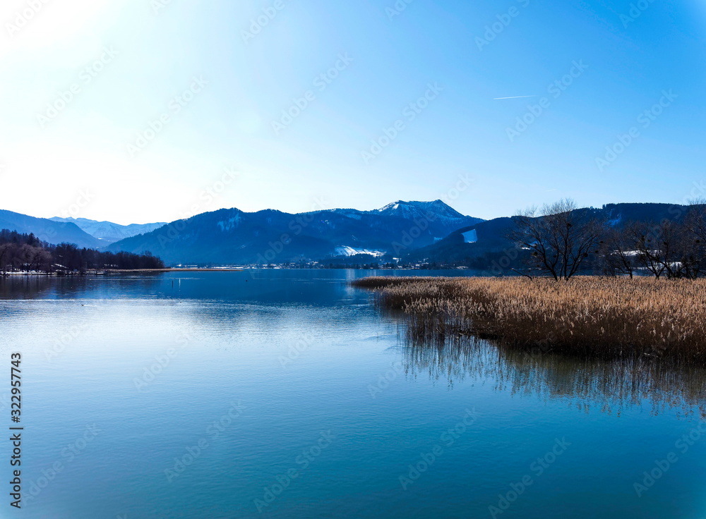 Gmund am Tegernsee in Upper Bavaria (Oberbayern) and view to magical waters of the lake and mountains lanscapes from the north shore of the Tegernsee lake in winter