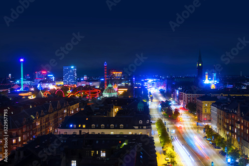 Aerial view of city center at night in Copenhagen, Denmark with car traffic