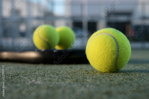 paddle tennis objects in court, racket, balls and net