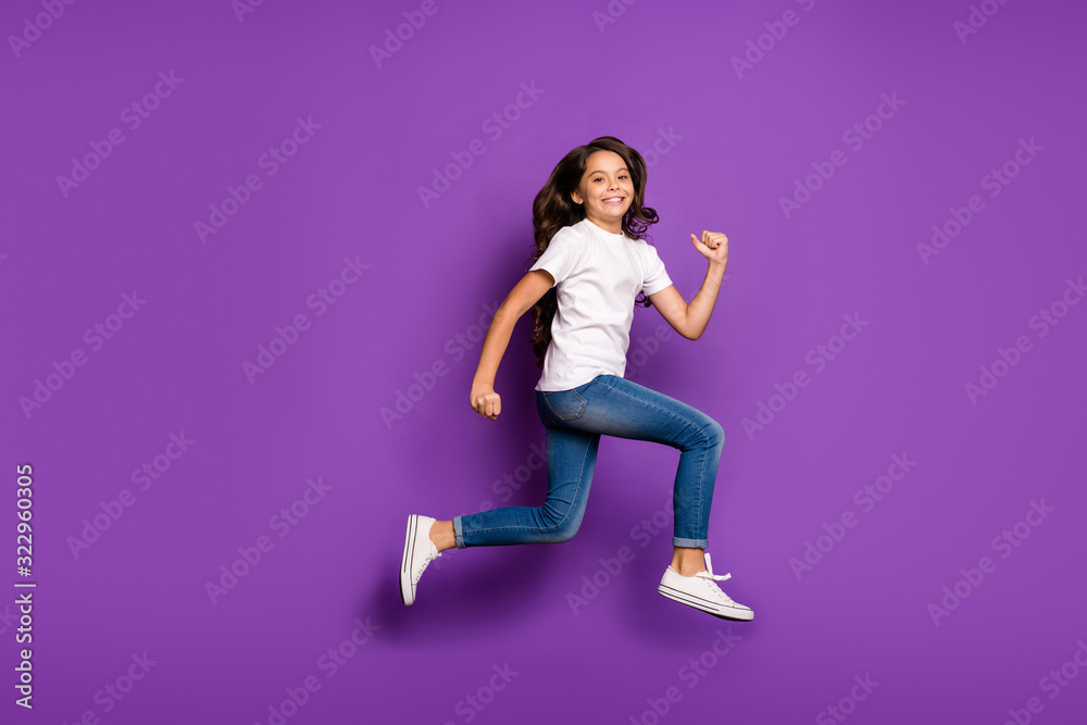 Full length body size view of her she nice attractive lovely cheerful cheery wavy-haired girl jumping running fast motion isolated on bright vivid shine vibrant purple violet lilac color background