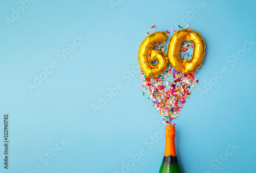 60th anniversary champagne bottle balloon pop photo