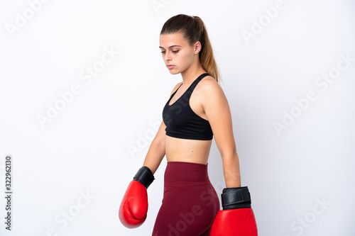 Teenager sport girl over isolated white background with boxing gloves