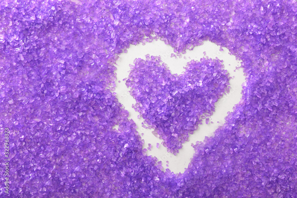 Background with lilac bath salts and heart top view