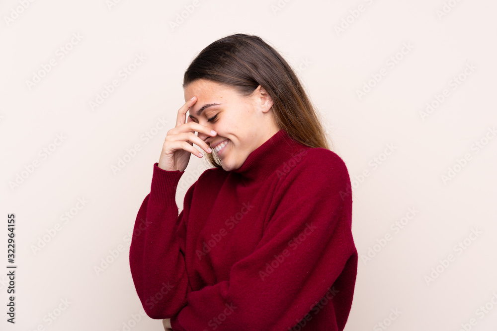 Teenager girl over isolated background laughing Teenager girl over isolated background laughing