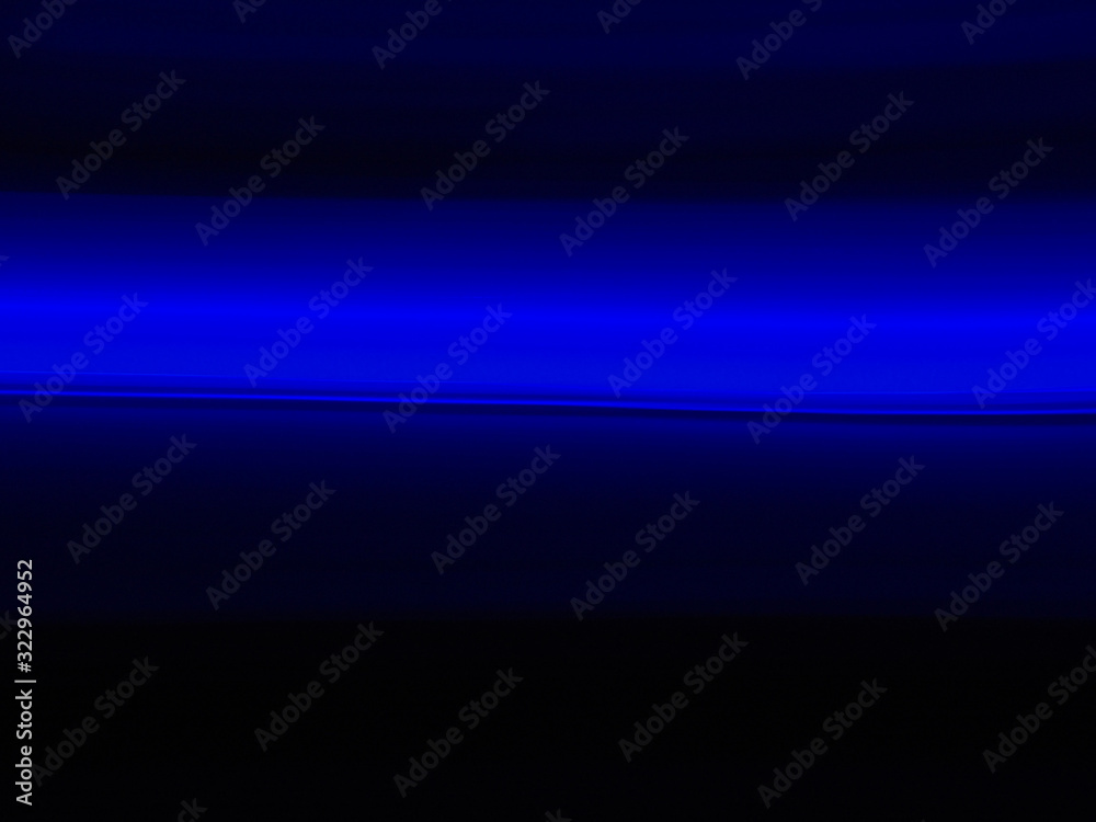Abstract fine art photography of blue horizontal blurred fast movement representing the concept of speed