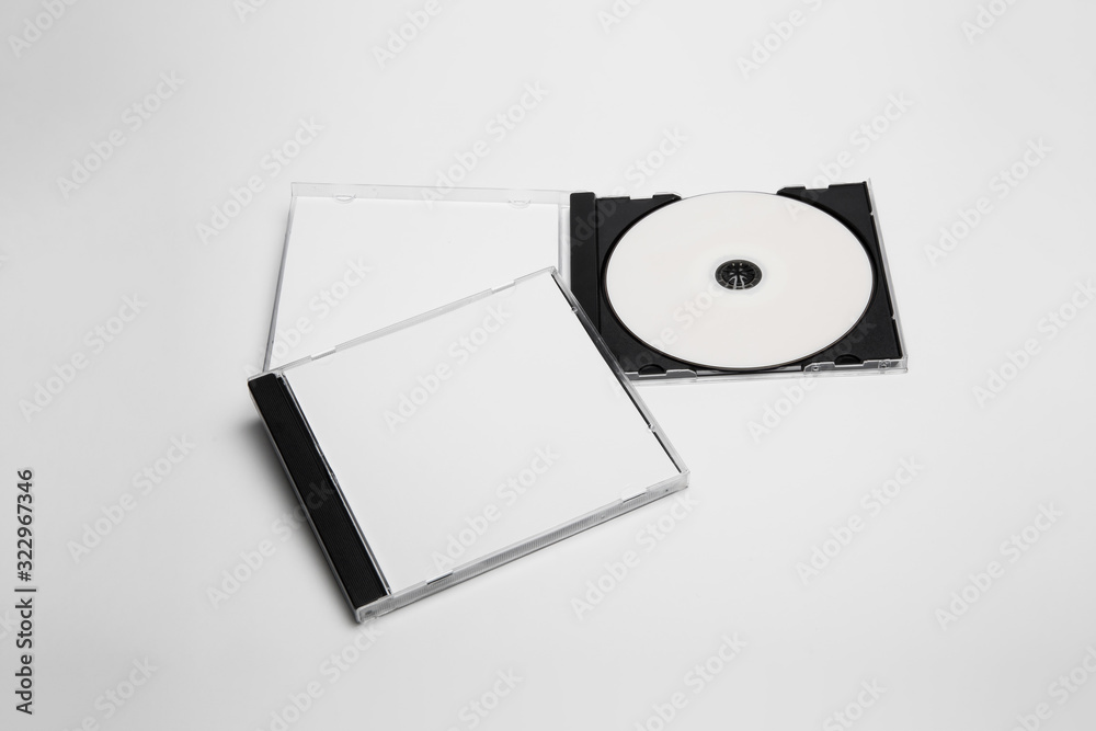 Open and close compact plastic disc box case set with white isolated blank  for branding design. CD jewel mock-up on soft gray background. DVD or CD  disc Photos | Adobe Stock