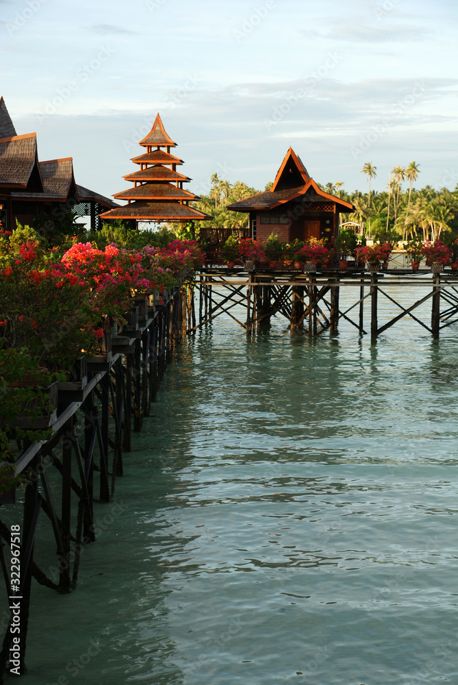 Obraz premium houses on the water against the turquoise sea and cloudy sky