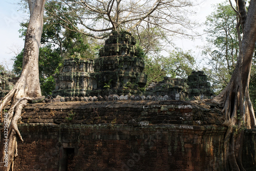 stone statues of the ancient temple complex of angkor watt in cambodia