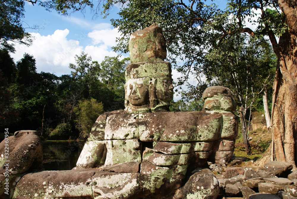 stone statues of the ancient temple complex of angkor watt in cambodia