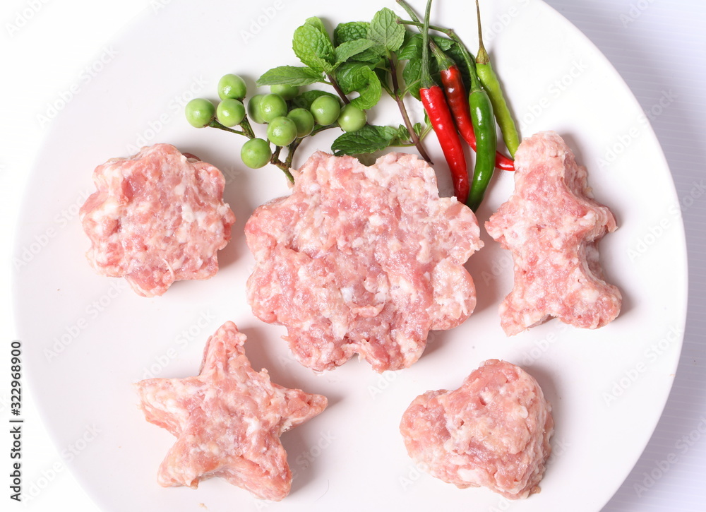 Raw ground meat on white plate for cooking Raw ground meat on white plate for cooking