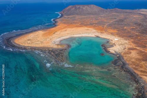 The Isla de Lobos in Fuerteventura, Spain with the Playa de la Concha. Aerial drone shot in october 2019