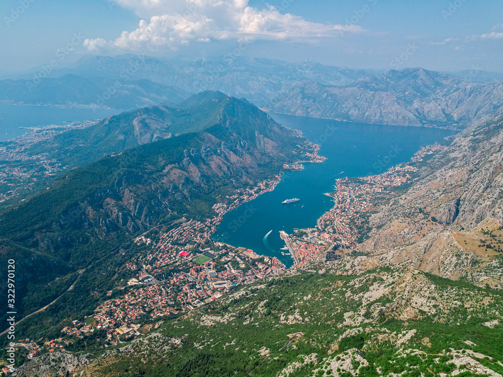 Aerial view of the Bay of Kotor, Boka. Old city of Kotor, fortifications. Mountain of St.John and the fortress. Tourism and cruise ships. The bay is the largest fjord  in the Mediterranean. Montenegro