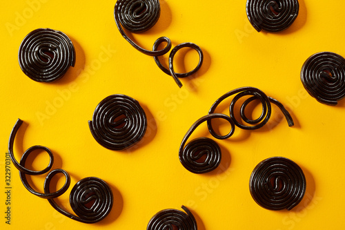 Coiled spirals of liquorice with trailing strands photo