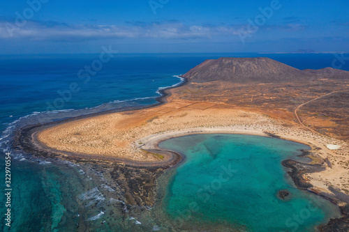 The Isla de Lobos in Fuerteventura, Spain with the Playa de la Concha. Aerial drone shot in october 2019 photo