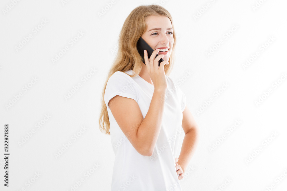 Girl talking on phone on white background, lady in white t shirt close up Girl talking on phone on white background, lady in white t shirt close up