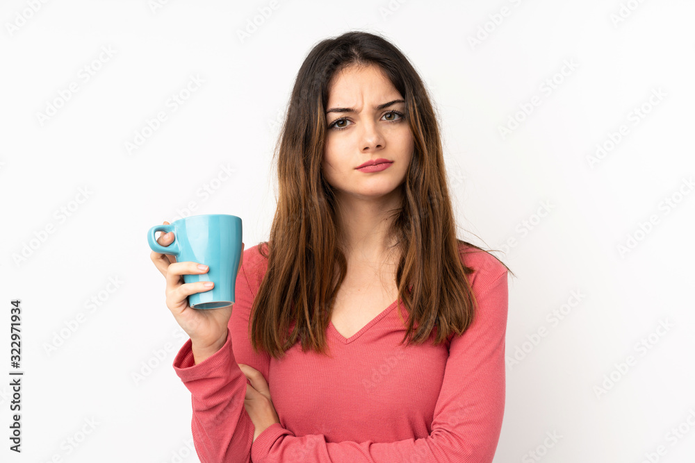 Young caucasian woman isolated on pink background holding colorful French macarons and with sad expression Young caucasian woman isolated on pink background holding colorful French macarons and with sad expression