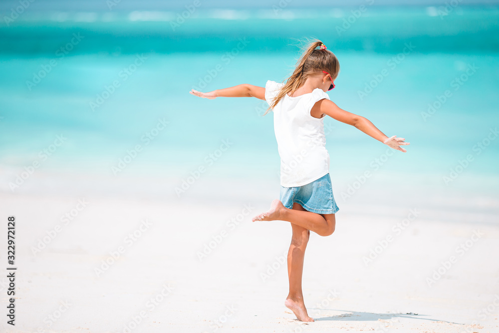 Cute little girl at beach during caribbean vacation Cute little girl at beach during caribbean vacation