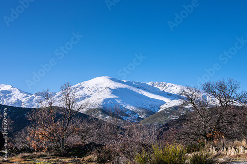 view of a snowy mountain in sunny day