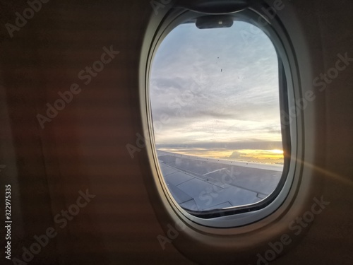 Beautiful sunset view from window plane